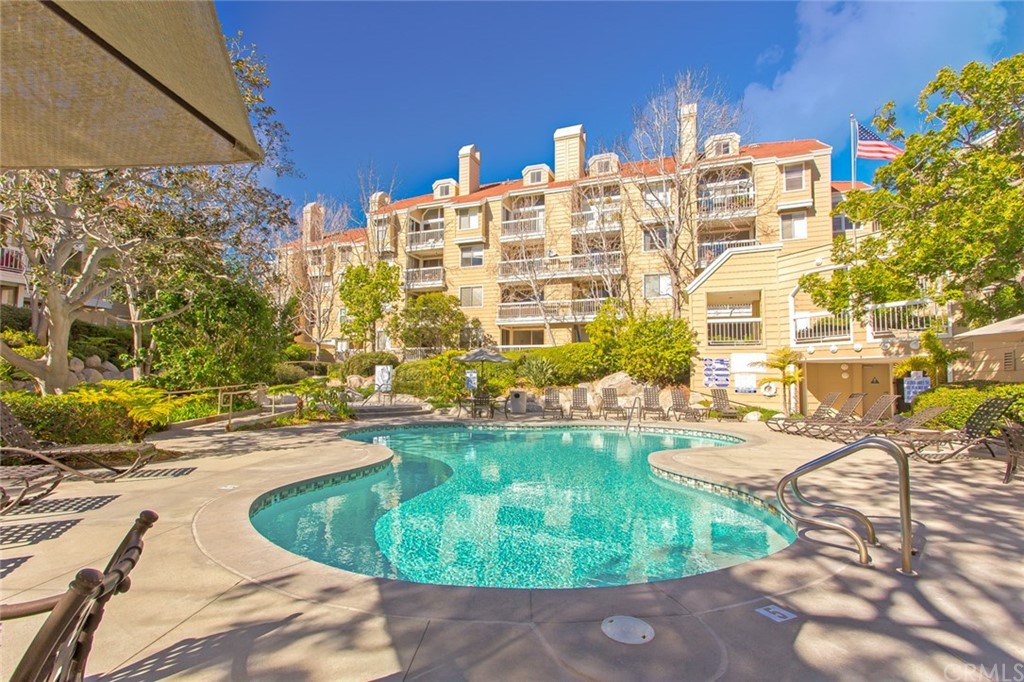 20331 Bluffside Circle, Unit A416 Huntington Beach, CA 92646 - Photo 34 of 42 a view of a swimming pool with a patio