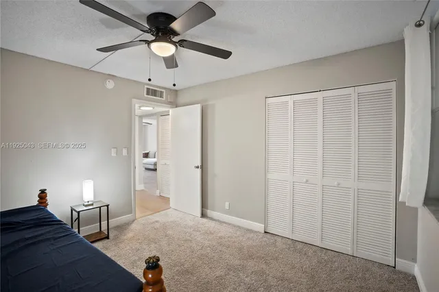 a very nice looking room with a chandelier fan