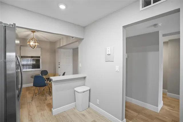 a room with a sink and a mirror