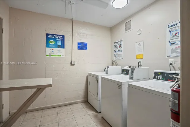 a view of storage and utility room with washer and dryer
