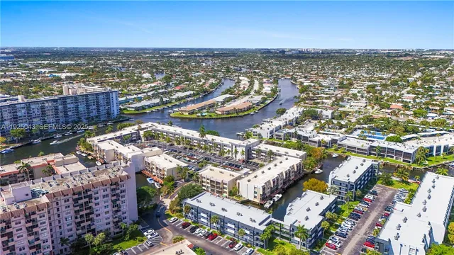 an aerial view of a city with ocean view
