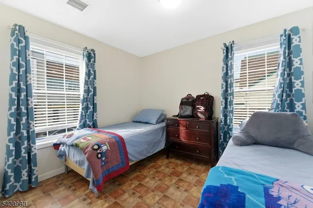 a bedroom with a bed and closet