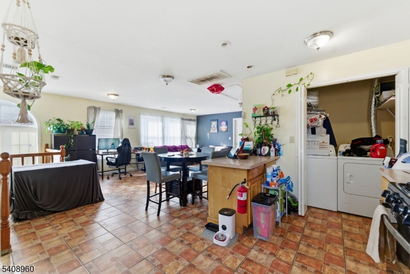 29 22nd Avenue Paterson, NJ 07513 - Photo 20 of 20 a view of a dining hall with lots of furniture and toys