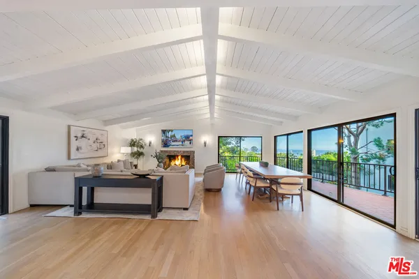 a kitchen with a refrigerator and a stove top oven