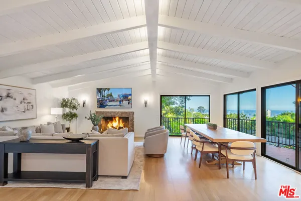 a kitchen with stainless steel appliances a refrigerator and wooden floor