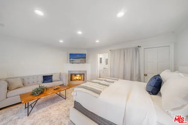 a bathroom with a granite countertop sink mirror and shower
