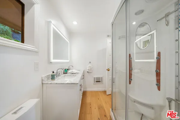 a living room with furniture fireplace and window