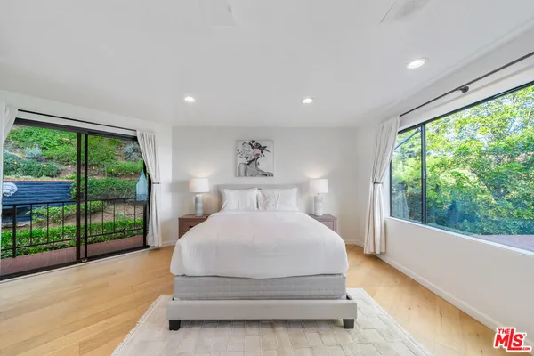 a bathroom with a sink a mirror and shower