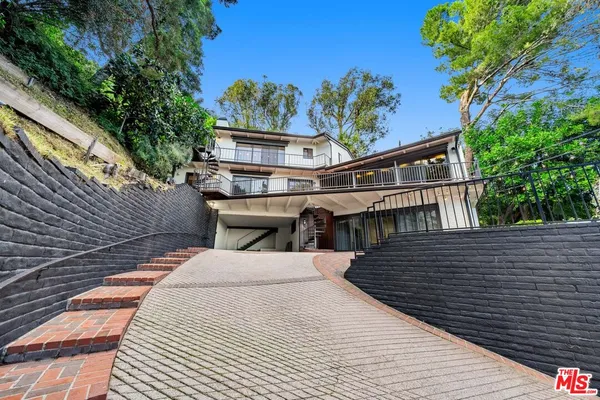 a view of balcony with furniture