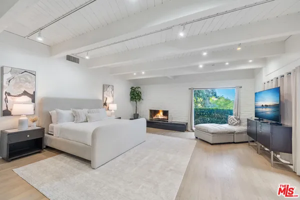 a front view of a residential apartment building with a yard