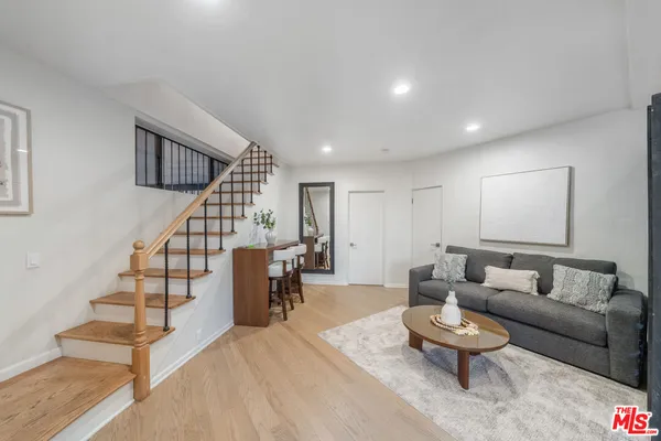 a bedroom with a large bed and a large window