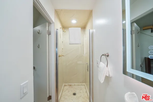 a view of a house with a small yard and floor to ceiling window