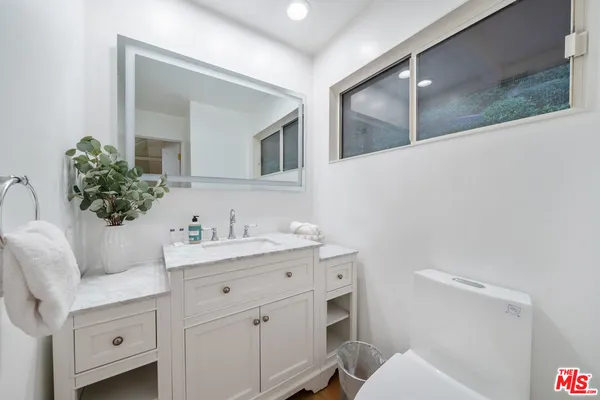 a view of a balcony with a potted plants