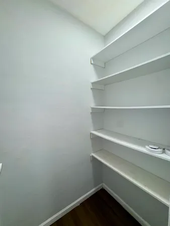 a view of an empty walk in closet