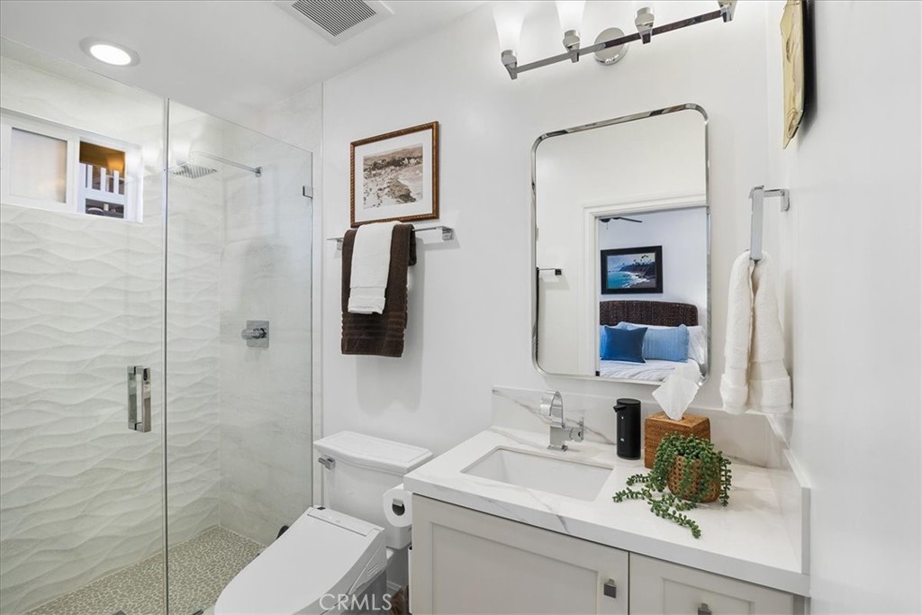 737 Griffith Way Laguna Beach, CA 92651 - Photo 11 of 22 a bathroom with a sink a toilet and shower