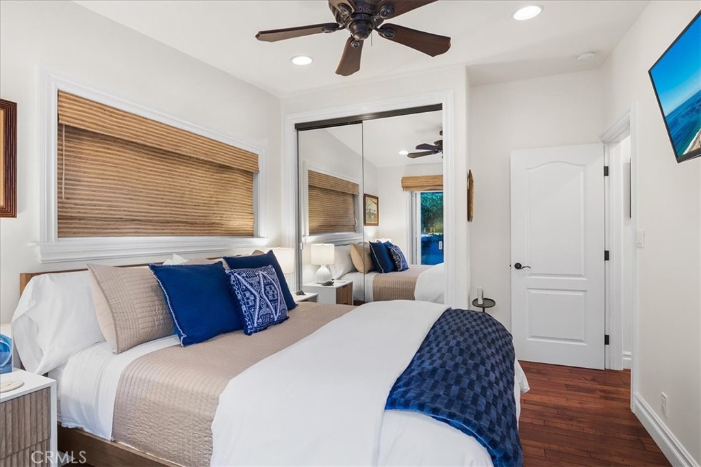 737 Griffith Way Laguna Beach, CA 92651 - Photo 13 of 22 a bedroom with a bed and a chandelier