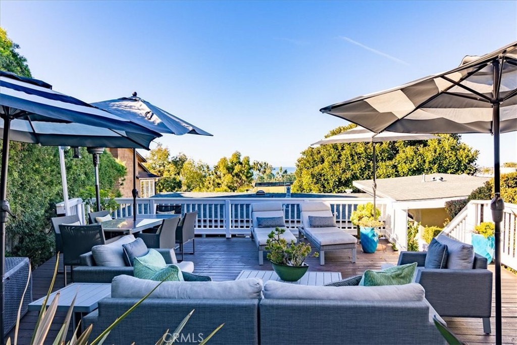 737 Griffith Way Laguna Beach, CA 92651 - Photo 16 of 22 a view of a patio with couches chairs and a potted plant