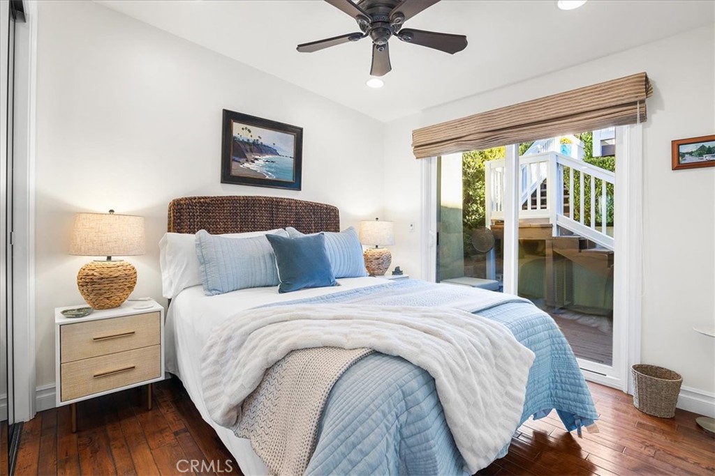 737 Griffith Way Laguna Beach, CA 92651 - Photo 9 of 22 a bedroom with a bed and wooden floor