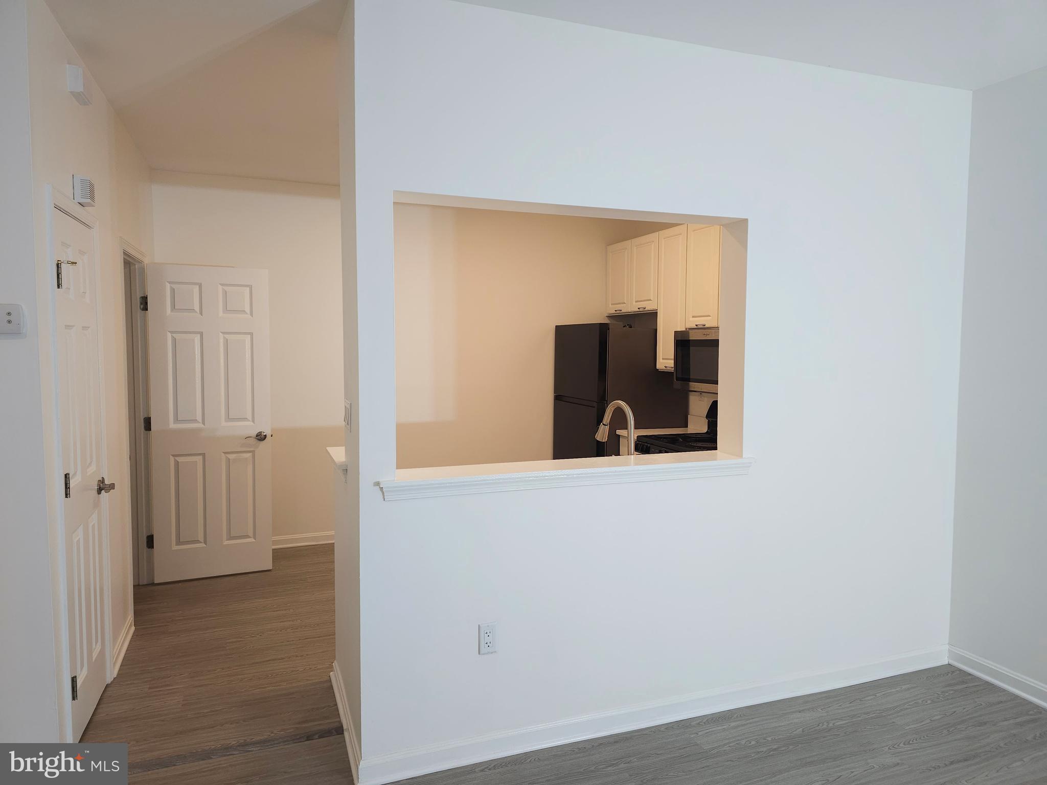 2014 Crosbyside Court Odenton, MD 21113 - Photo 11 of 58 a view of a hallway with wooden floor