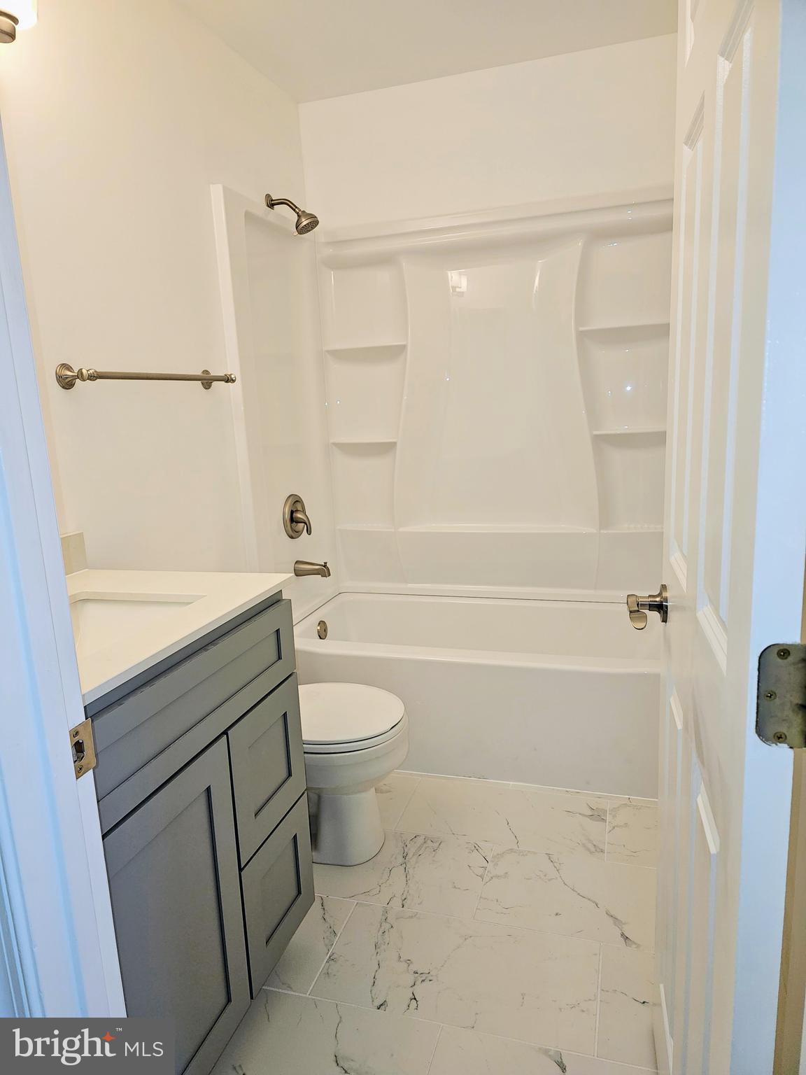 2014 Crosbyside Court Odenton, MD 21113 - Photo 20 of 58 a bathroom with a sink a toilet and shower