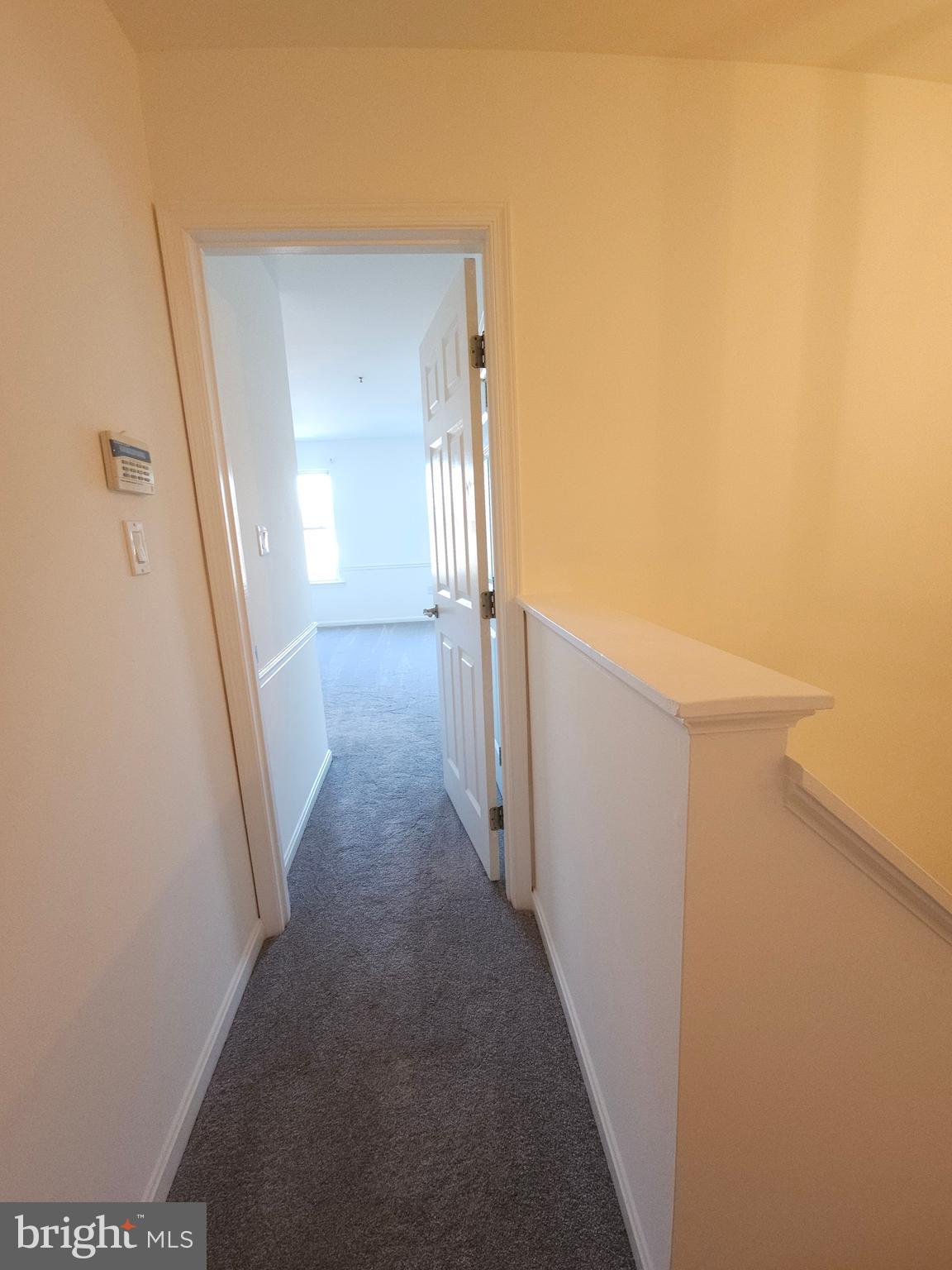 2014 Crosbyside Court Odenton, MD 21113 - Photo 22 of 58 a view of a hallway with wooden floor and staircase