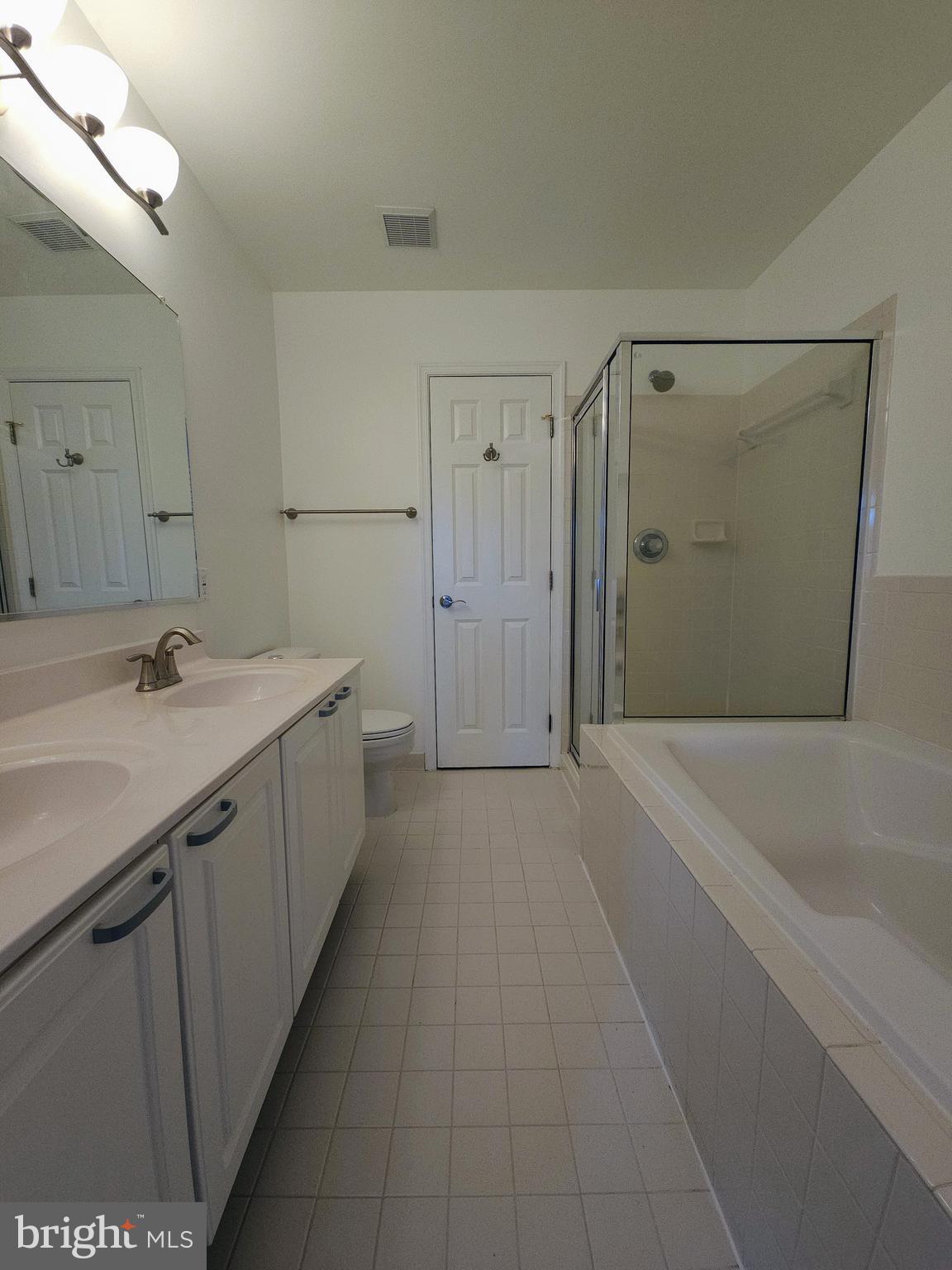 2014 Crosbyside Court Odenton, MD 21113 - Photo 25 of 58 a spacious bathroom with a tub sink and mirror