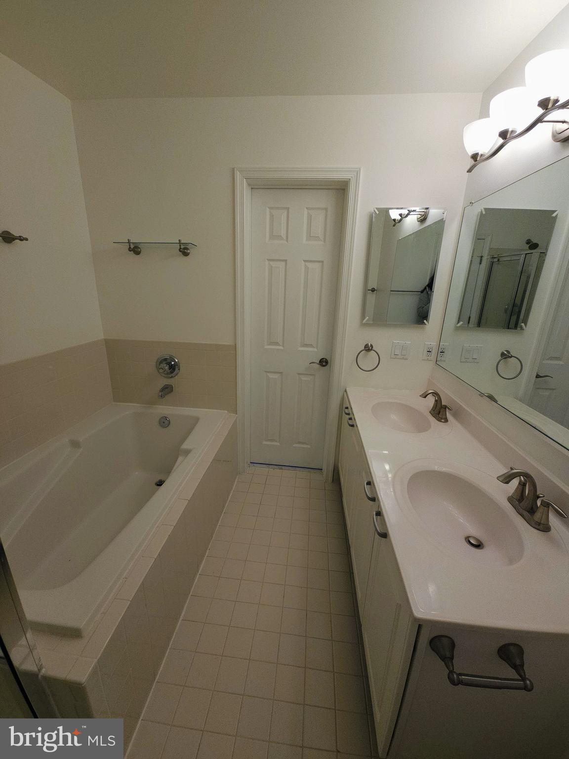 2014 Crosbyside Court Odenton, MD 21113 - Photo 26 of 58 a bathroom with a tub sink a mirror and vanity