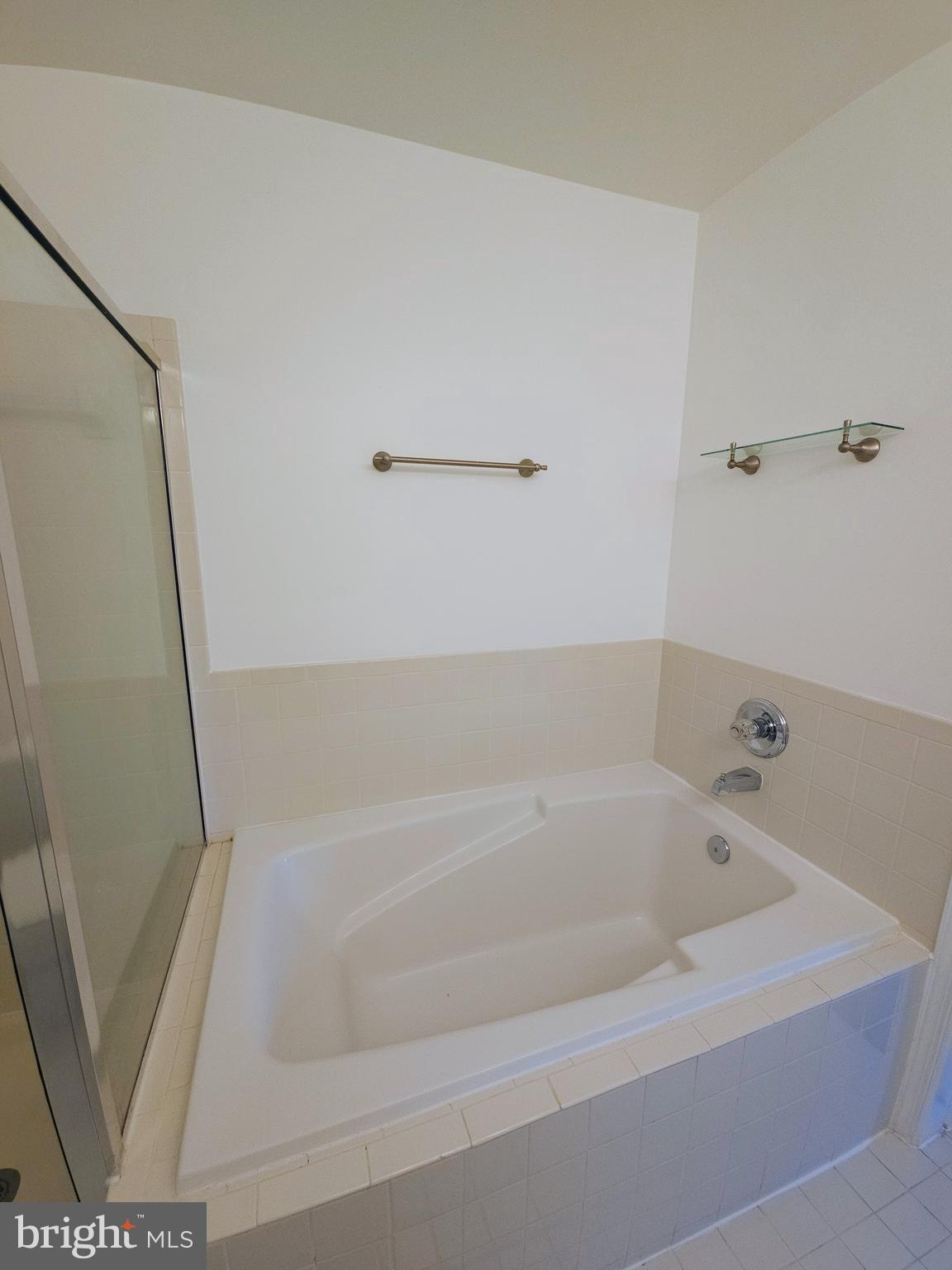 2014 Crosbyside Court Odenton, MD 21113 - Photo 28 of 58 a white bath tub sitting next to a sink