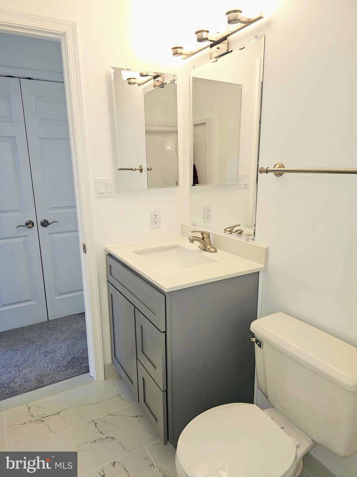 2014 Crosbyside Court Odenton, MD 21113 - Photo 45 of 58 a bathroom with a sink mirror vanity and toilet