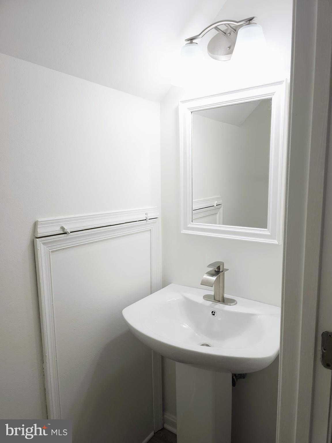 2014 Crosbyside Court Odenton, MD 21113 - Photo 49 of 58 a bathroom with a sink a mirror and a vanity