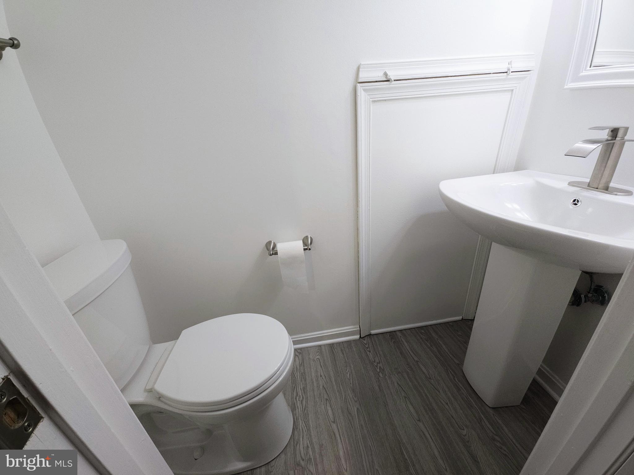 2014 Crosbyside Court Odenton, MD 21113 - Photo 51 of 58 a white toilet sitting next to a bathroom sink