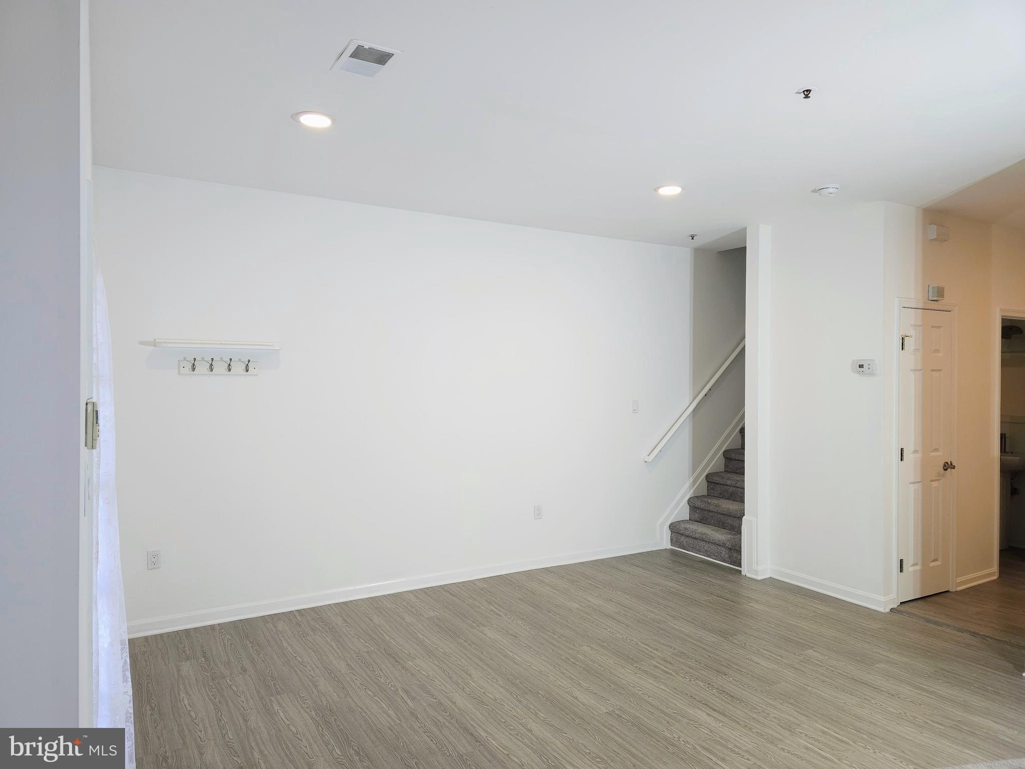 2014 Crosbyside Court Odenton, MD 21113 - Photo 52 of 58 an empty room with wooden floor and white doors