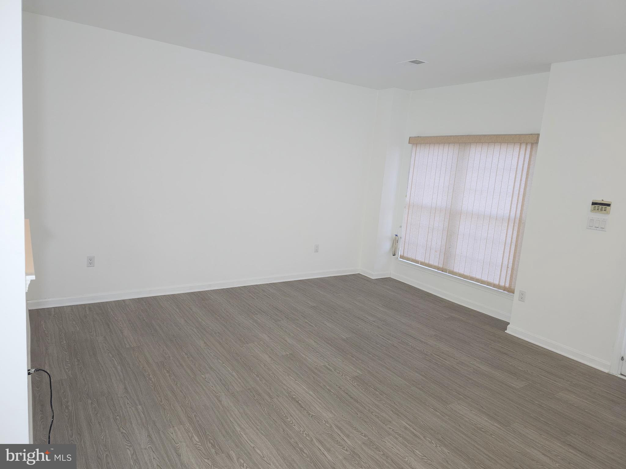 2014 Crosbyside Court Odenton, MD 21113 - Photo 53 of 58 an empty room with wooden floor and windows
