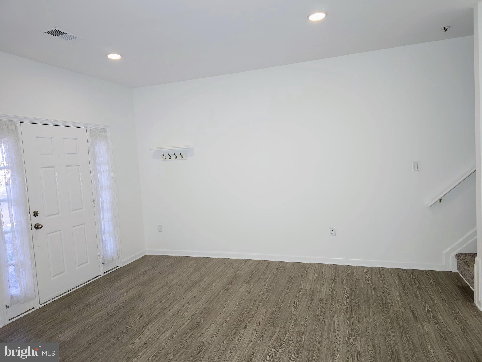 2014 Crosbyside Court Odenton, MD 21113 - Photo 7 of 58 an empty room with wooden floor and windows