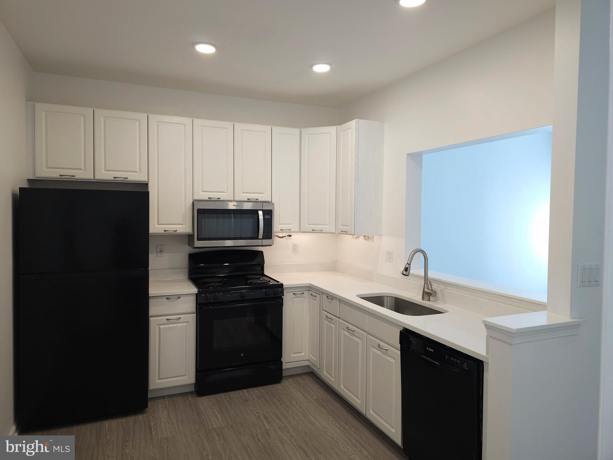2014 Crosbyside Court Odenton, MD 21113 - Photo 8 of 58 a kitchen with a sink and white cabinets