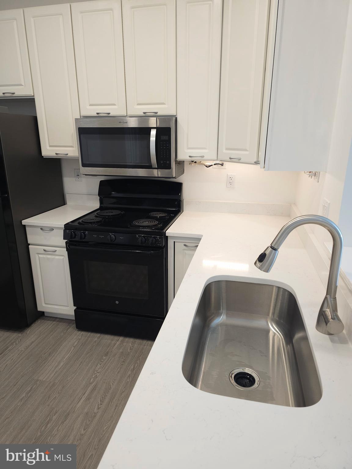 2014 Crosbyside Court Odenton, MD 21113 - Photo 9 of 58 a kitchen with a sink and a stove