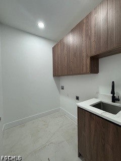 3603 4th Street West Lehigh Acres, FL 33971 - Photo 23 of 28 a kitchen with a sink and cabinets