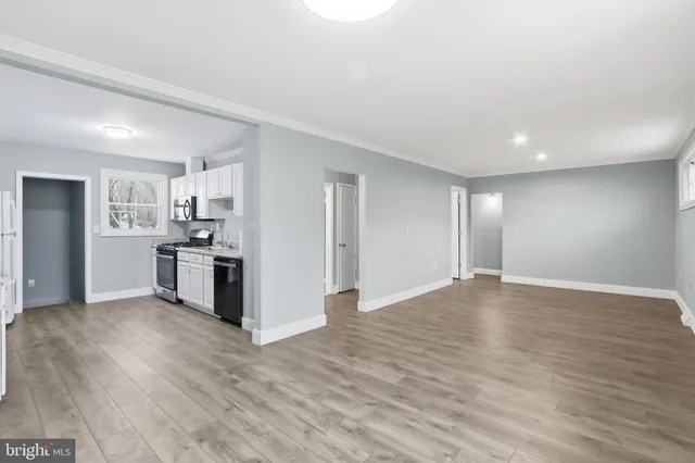 a view of kitchen with wooden floor