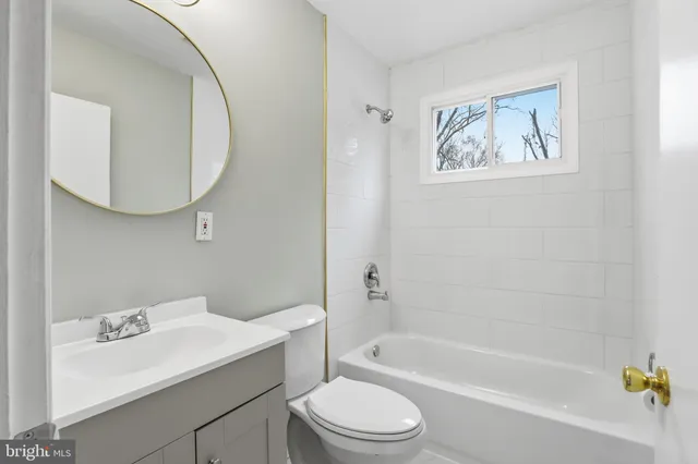 a bathroom with a sink toilet and bathtub