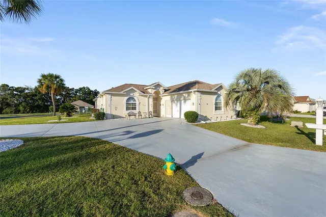 a view of house with outdoor space and sitting area