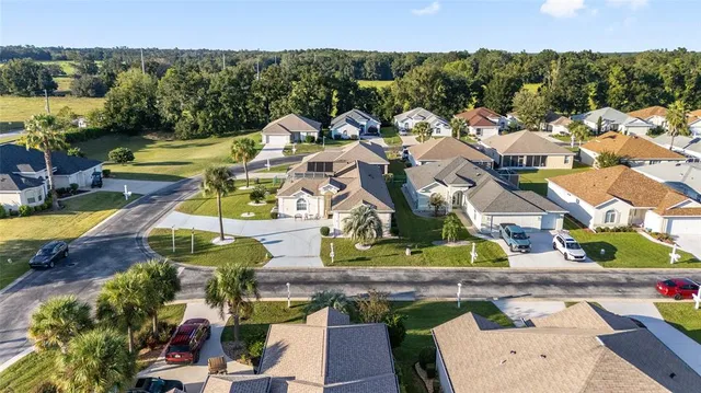 an aerial view of a house with a ocean view