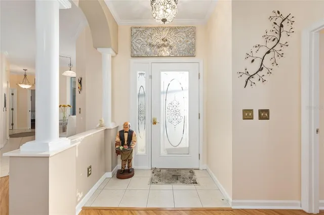 a dining room with furniture and a chandelier