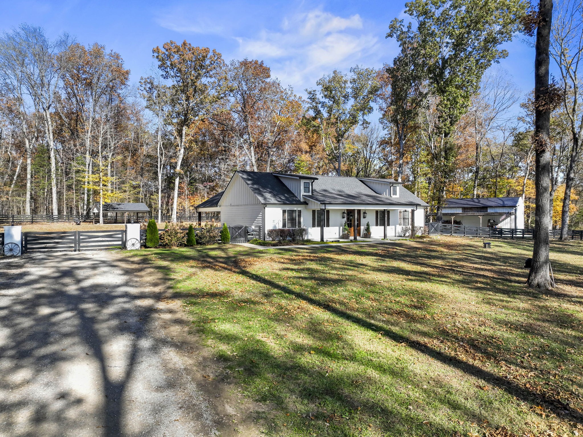 a front view of a house with a big yard