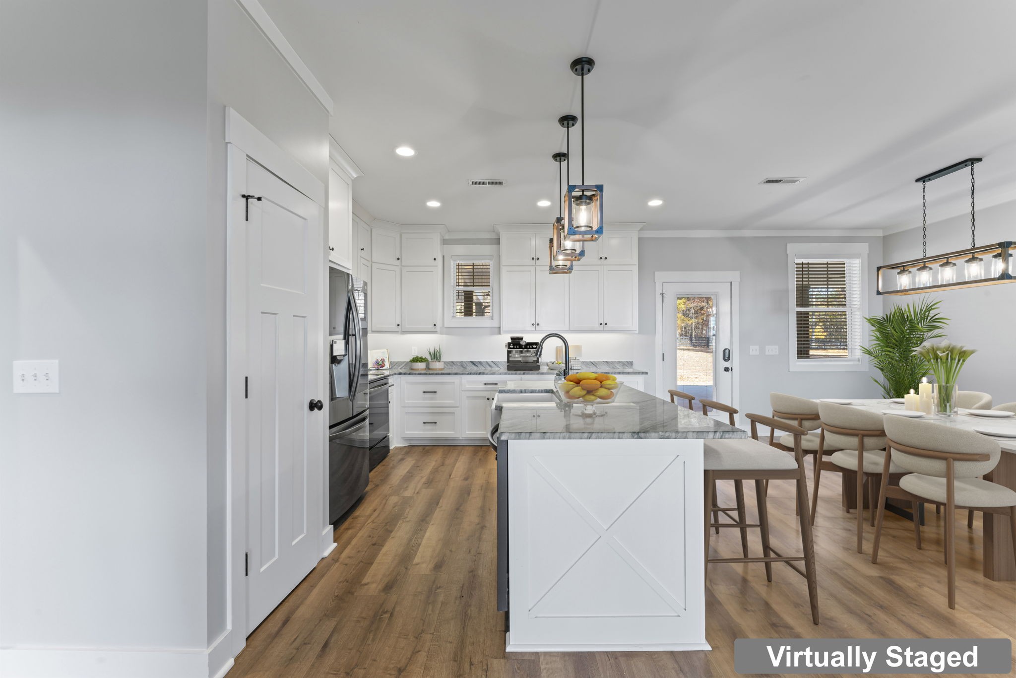 5706 Lunns Store Road Chapel Hill, TN 37034 - Photo 11 of 37 a large white kitchen with stainless steel appliances kitchen island granite countertop a refrigerator a stove a sink dishwasher and white cabinets with wooden floor