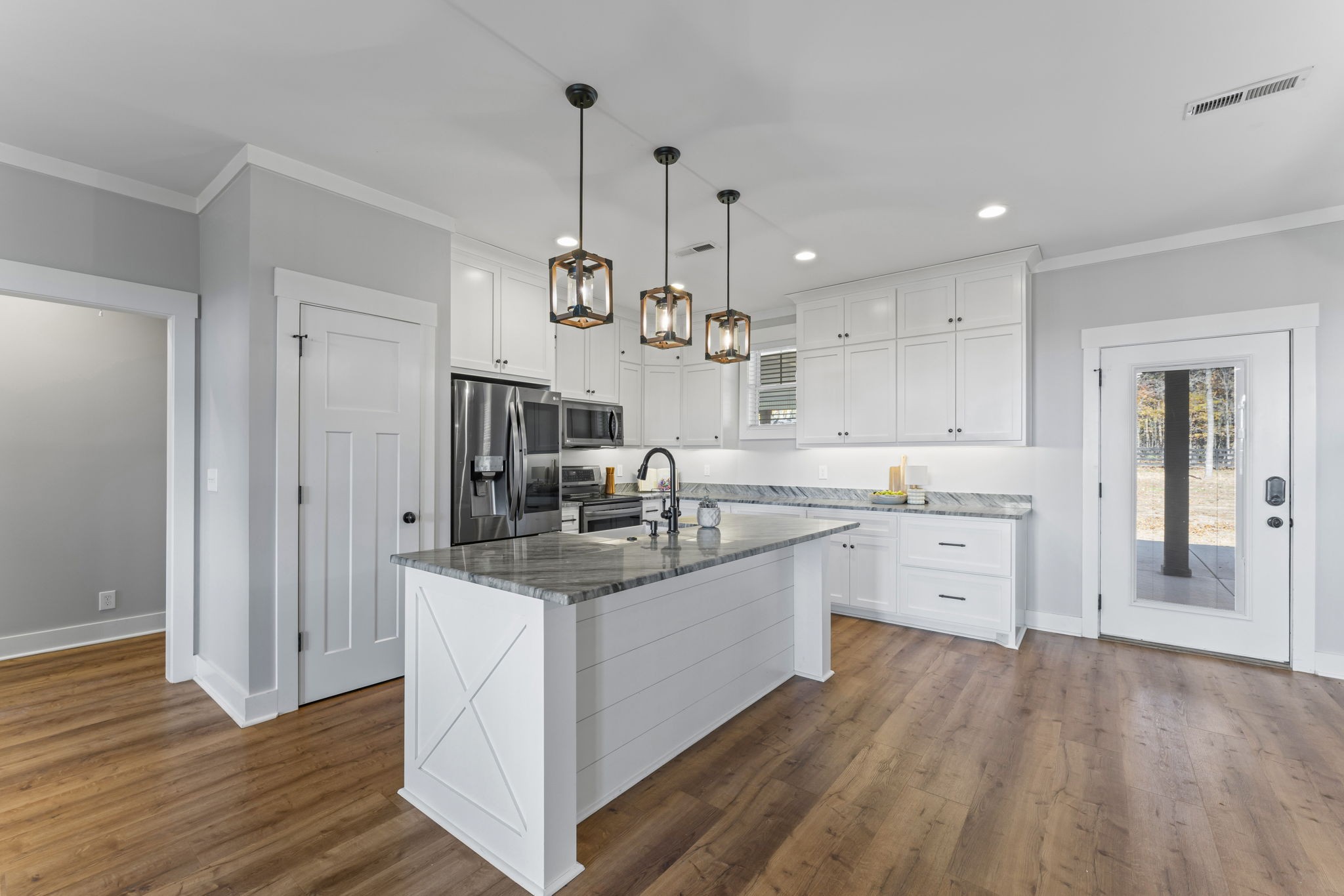 5706 Lunns Store Road Chapel Hill, TN 37034 - Photo 12 of 37 a very nice looking kitchen with granite countertop a sink cabinets and wooden floor