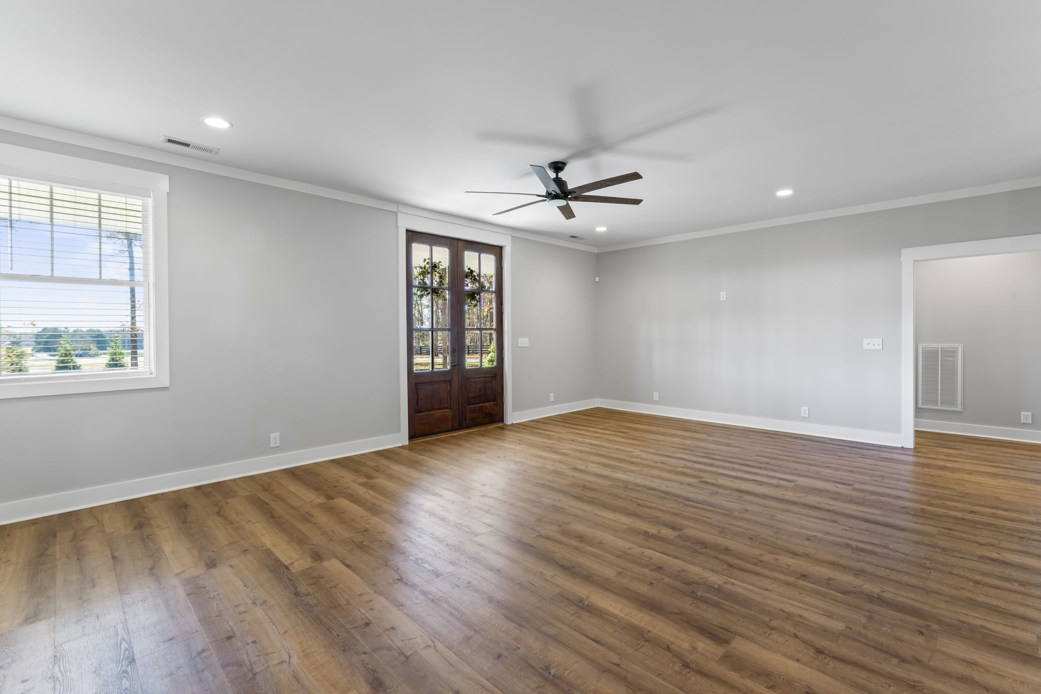 5706 Lunns Store Road Chapel Hill, TN 37034 - Photo 5 of 37 a view of an empty room with a window and wooden floor