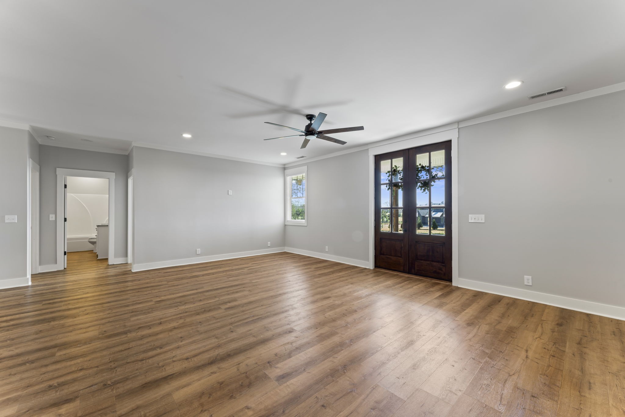 5706 Lunns Store Road Chapel Hill, TN 37034 - Photo 7 of 37 a view of an empty room with window and wooden floor