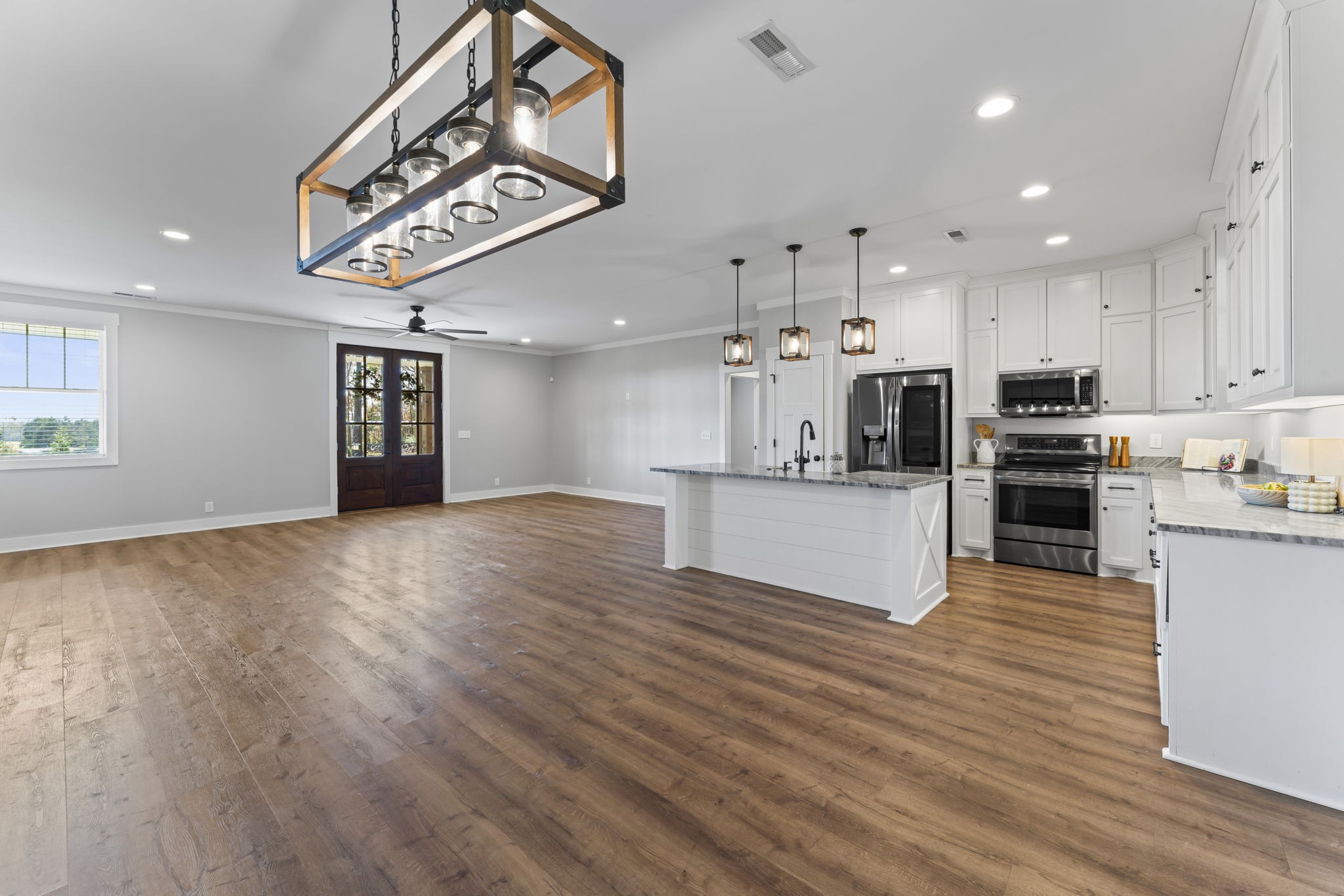 5706 Lunns Store Road Chapel Hill, TN 37034 - Photo 8 of 37 a large kitchen with stainless steel appliances kitchen island a large counter top and wooden floors