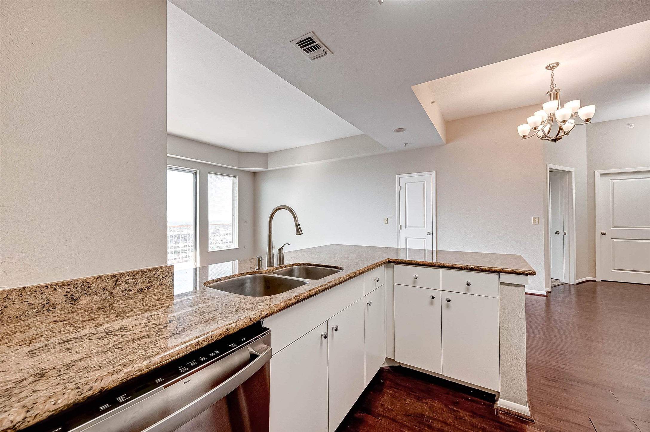 3505 Sage Road, Unit 2106 Houston, TX 77056 - Photo 12 of 28 a kitchen with granite countertop a sink and cabinets