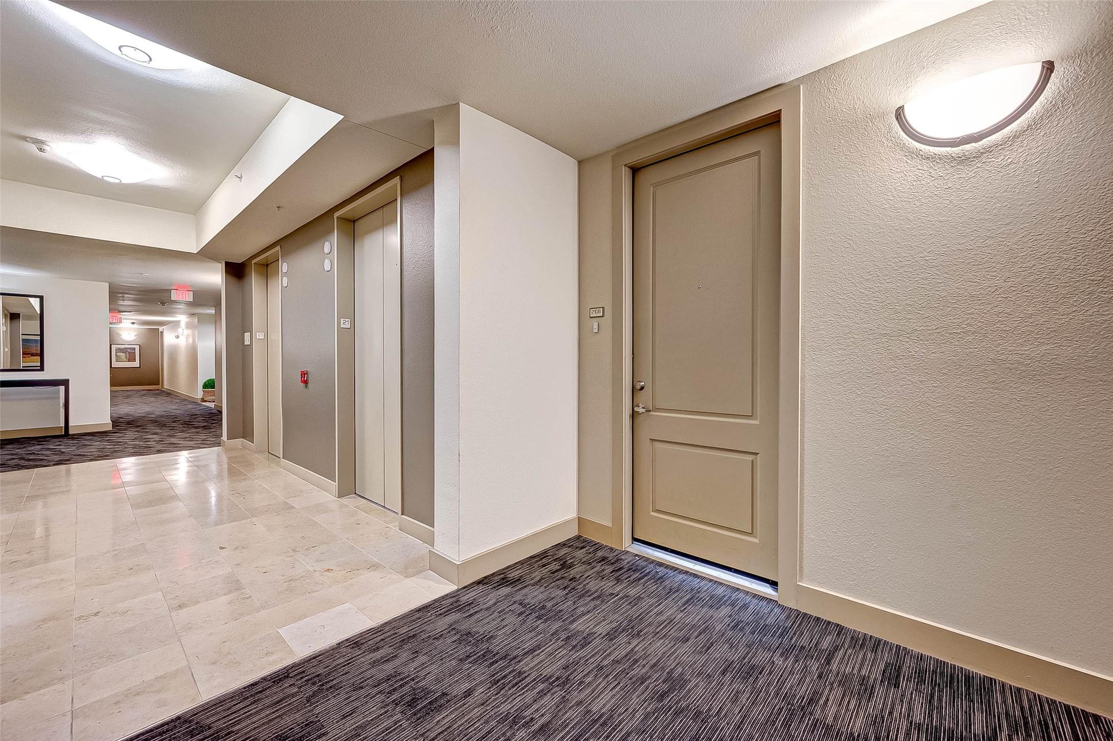 3505 Sage Road, Unit 2106 Houston, TX 77056 - Photo 21 of 28 a view of a big room with wooden floor and bathroom